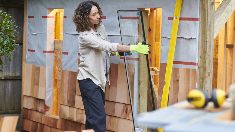 Woman building a shed