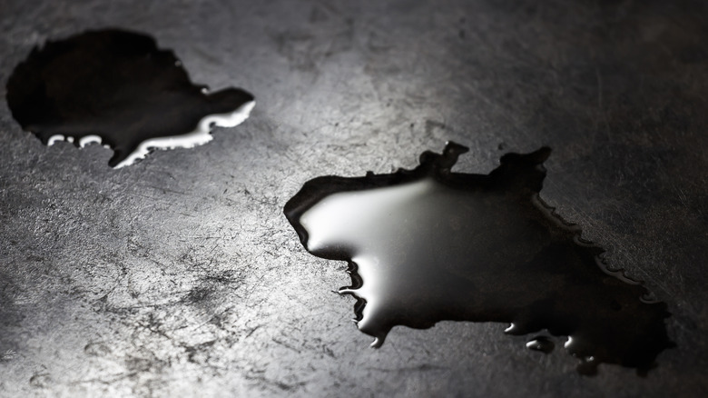 water spilled on black countertop