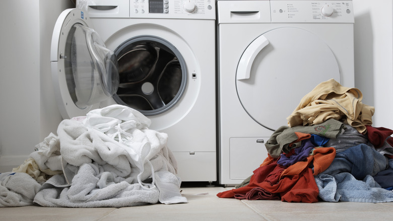 white and colored laundry piles