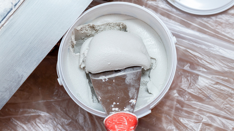 Open jar of spackle