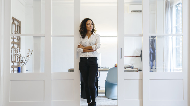 Woman standing in between sliding doors