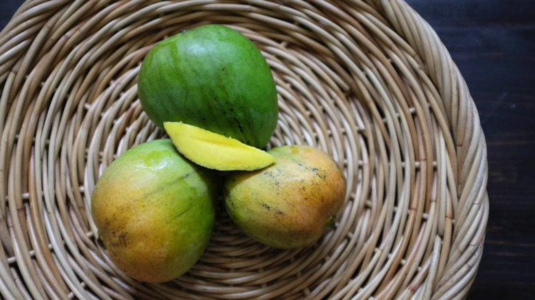 Ice cream mangoes on a rattan plate