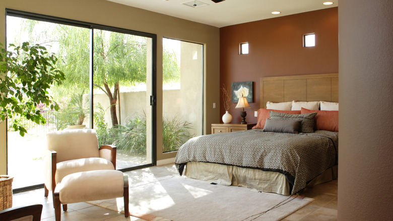 A bedroom with a sliding glass door