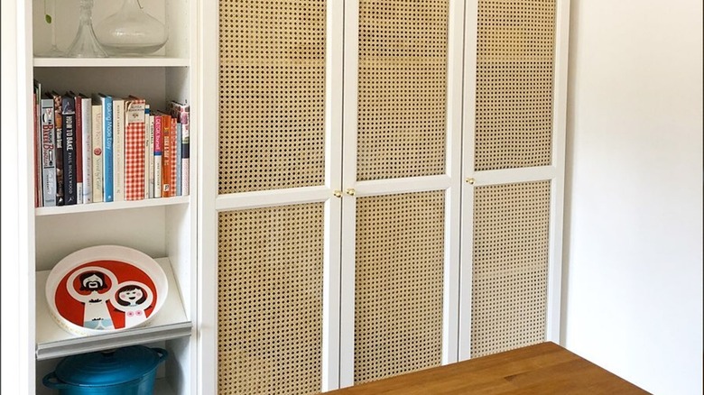 Bookcase with tan cane doors