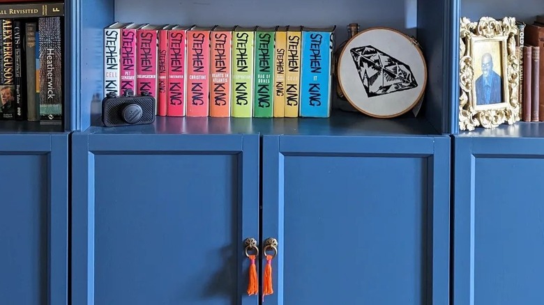 Blue bookcase with tassel handles