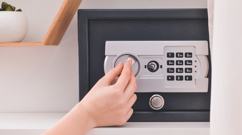 Woman opening a safe 