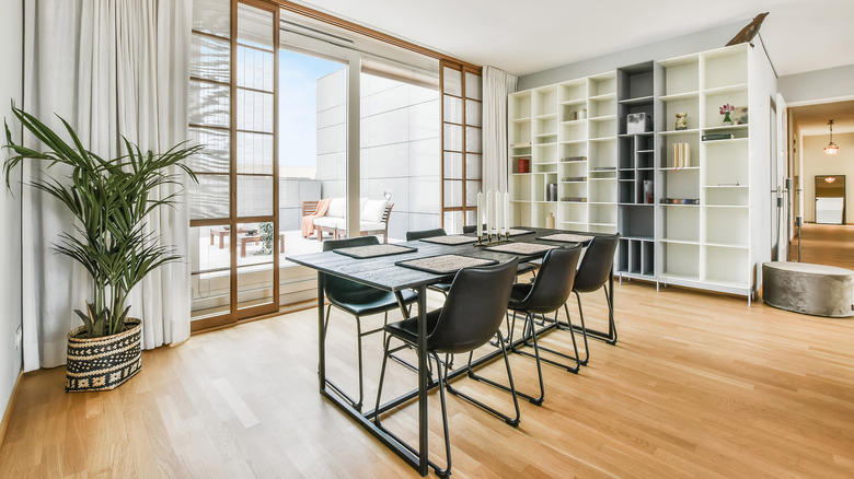 Bright dining room with built in bookshelf