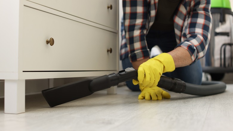 Vaccuming under dresser