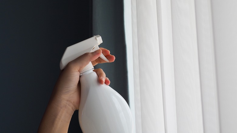 Spray bottle white curtains