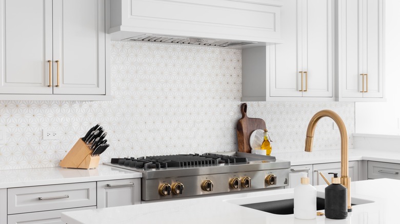 white kitchen with tile backsplash