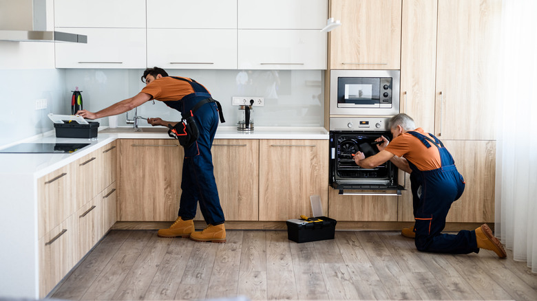 Contractors working on kitchen renovation