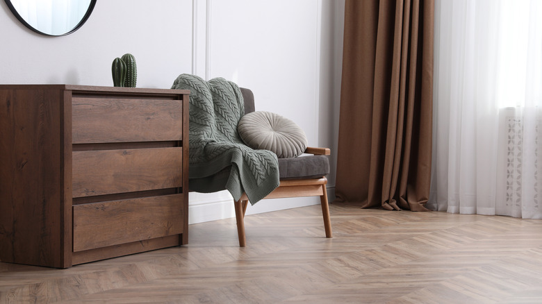 Dresser and chair on hardwood