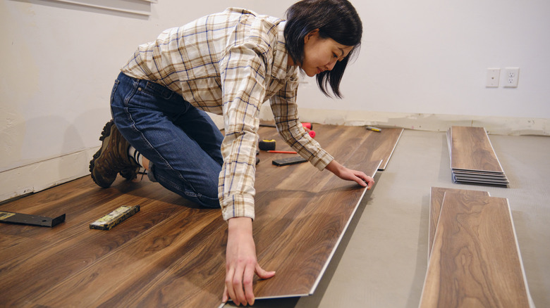 woman renovating floor