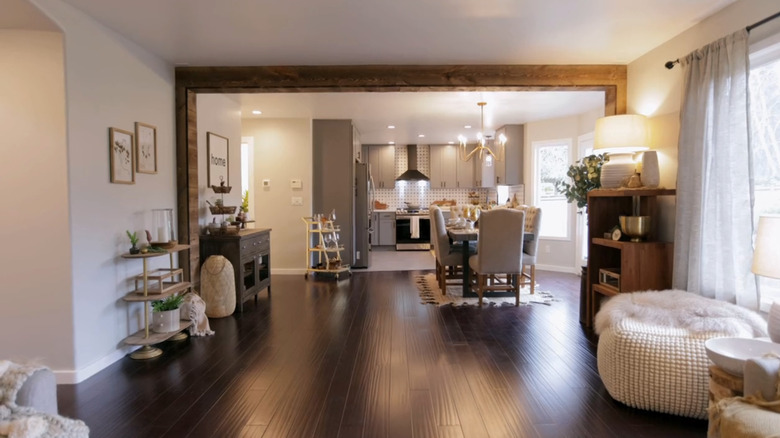 living room with open floor plan and dark wooden floors