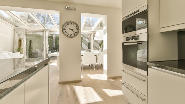 kitchen area with wall clock