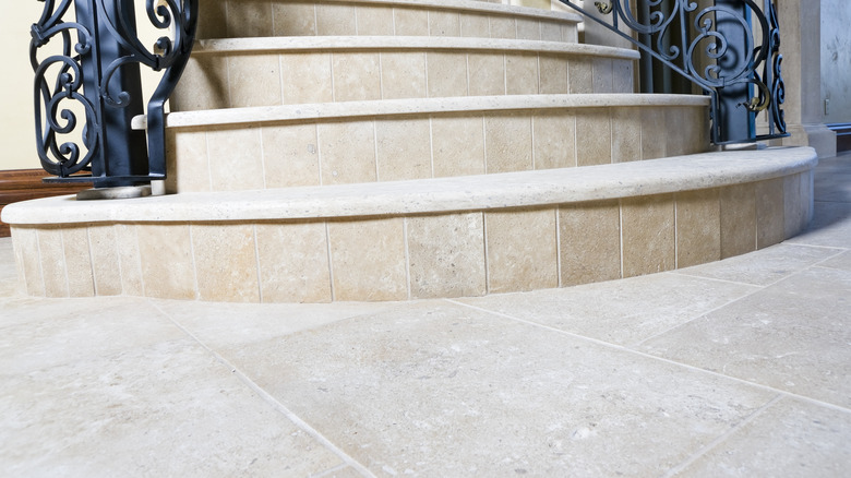 Staircase with limestone flooring