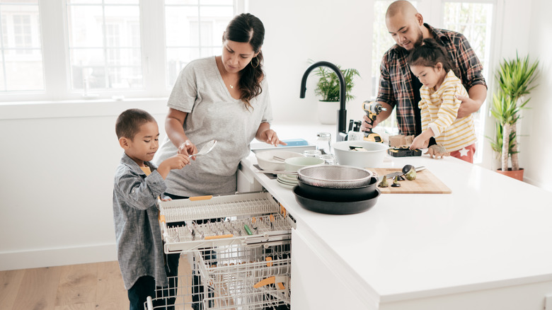 family loading dishwasher