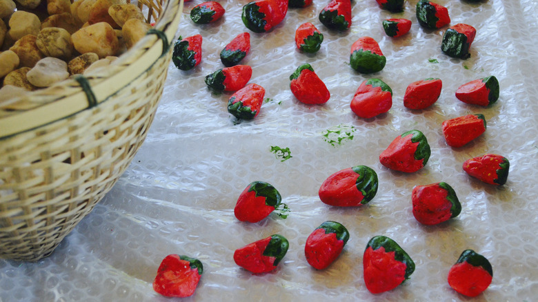 Rocks painted as strawberries