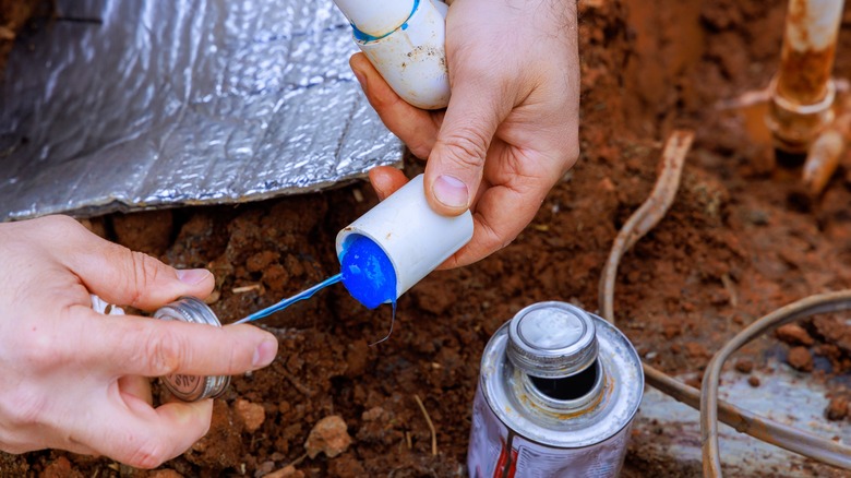 Man applying epoxy adhesive 