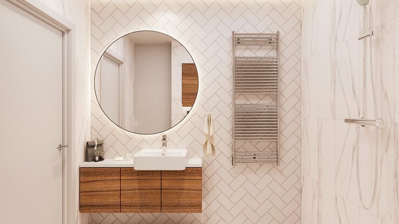 Bathroom with a backlit mirror