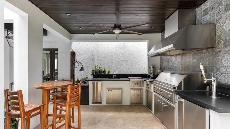 kitchen with dark wood panel ceiling