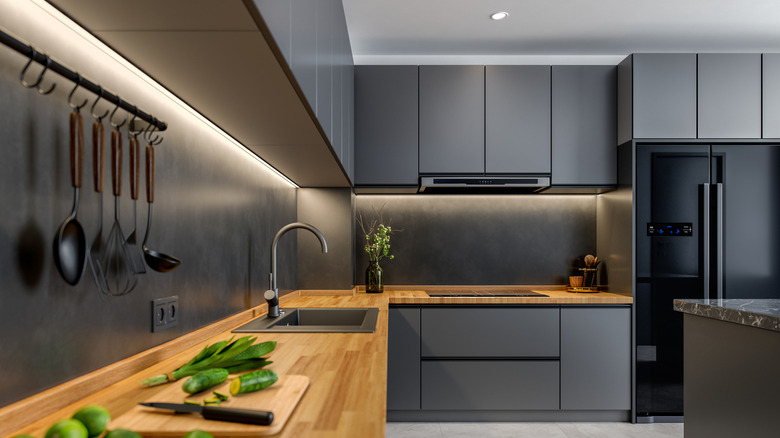 Dark gray cabinets with wood elements