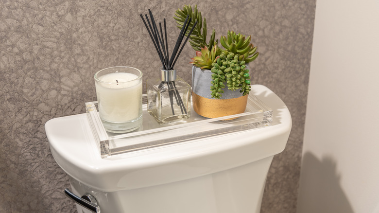 decorative tray on toilet tank