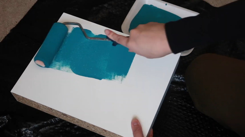 hand painting white shelf blue