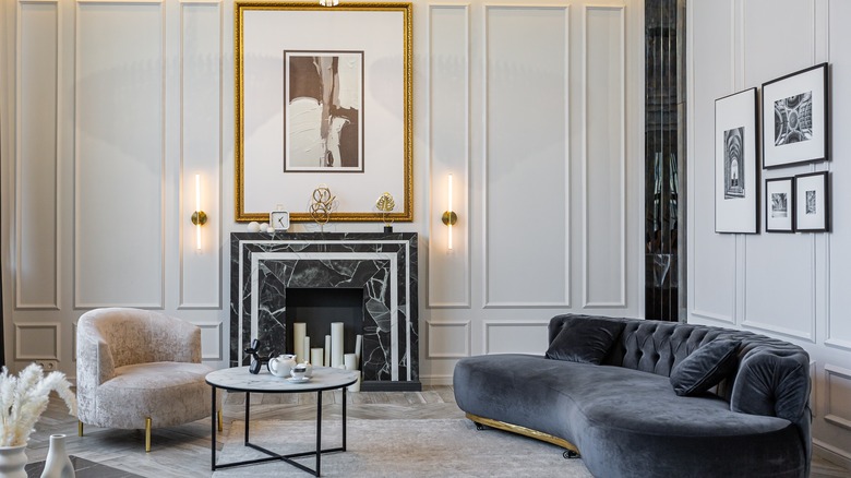 A luxury kitchen containing marble and wood surfaces