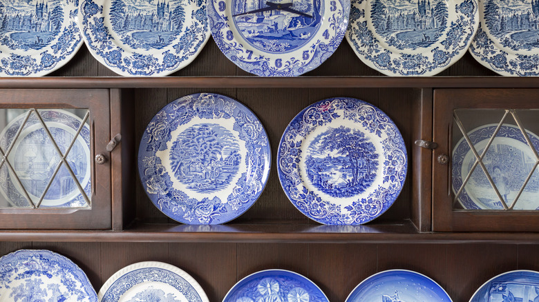 Vintage plates in cupboard