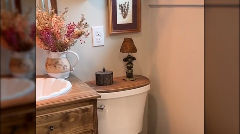 Wood topper on toilet tank