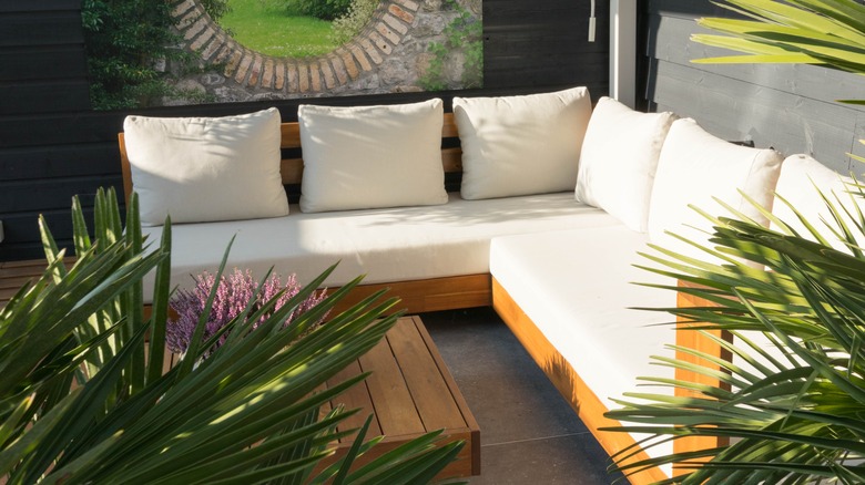 Acacia wood patio furniture with white cushions