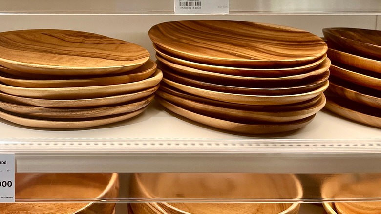 Acacia wood plates and bowls on a shelf