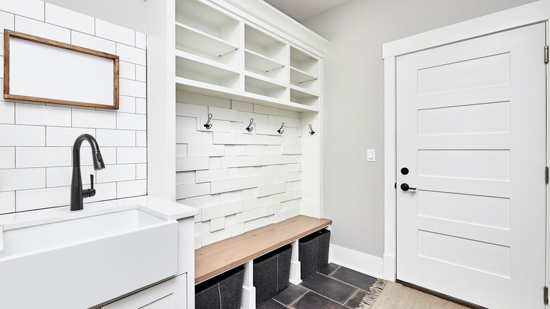 Mudroom with sink and bench