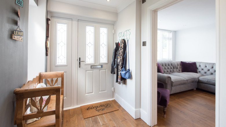 Entryway with hooks and wood bench