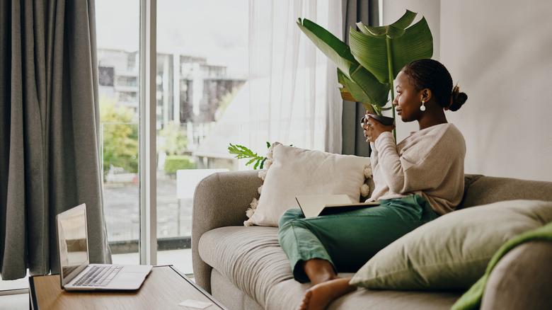 Woman sits in quiet house