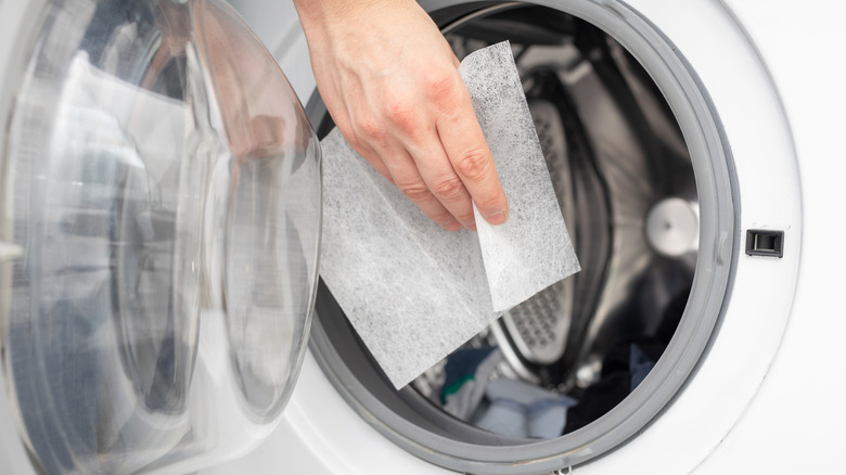 Putting dryer sheet in dryer