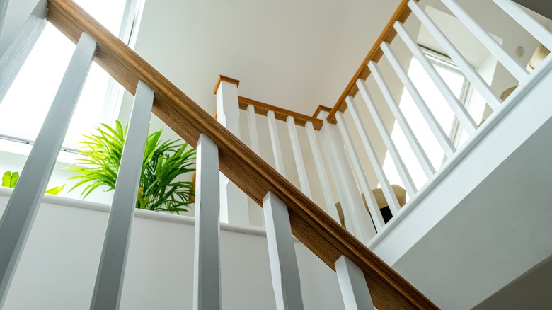 a white stair well ceiling