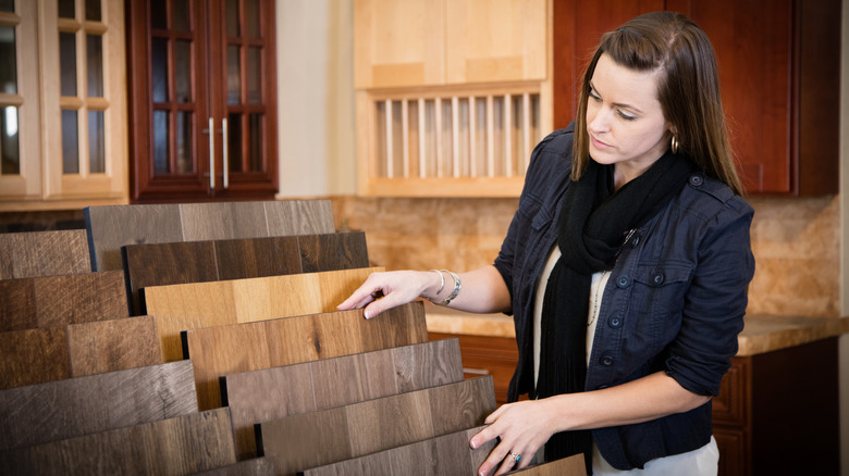 A woman shopping for flooring in a store