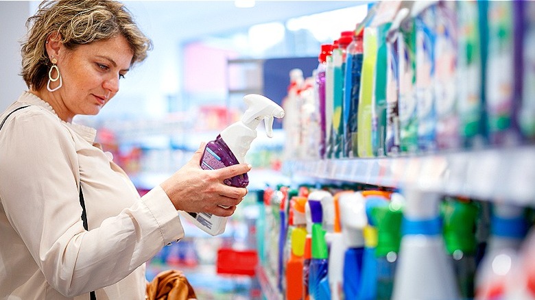 Person looking at a bottle