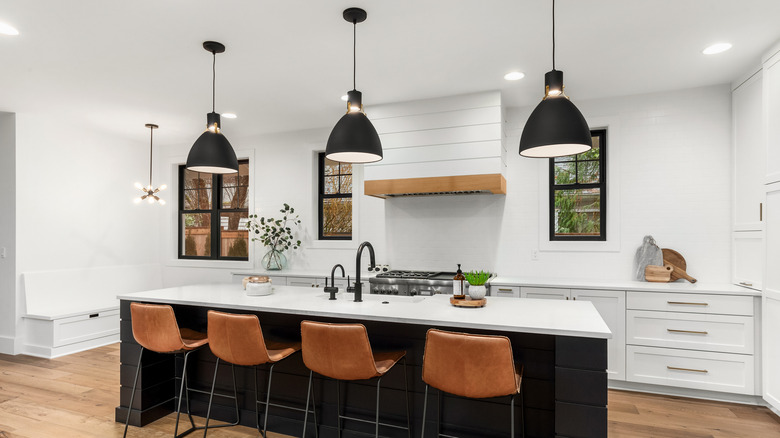 black pendant lights in white kitchen