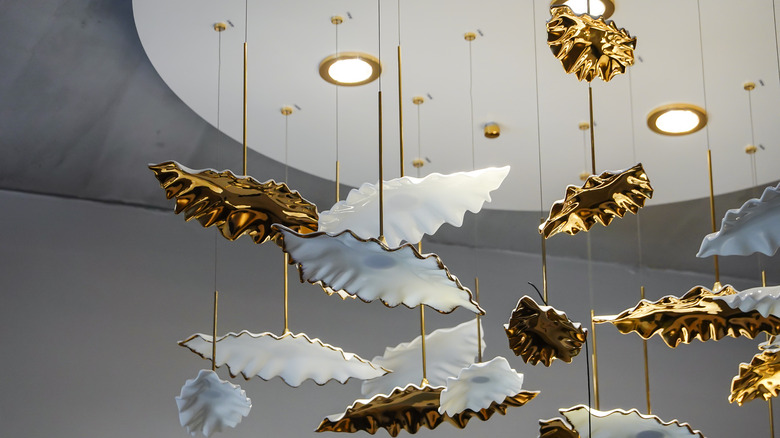 gold and white leaf sculpture pendants