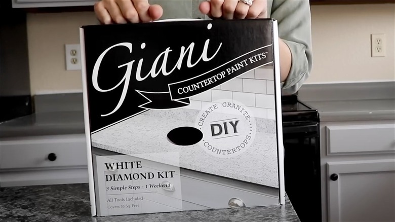 person holding Giani countertop kit