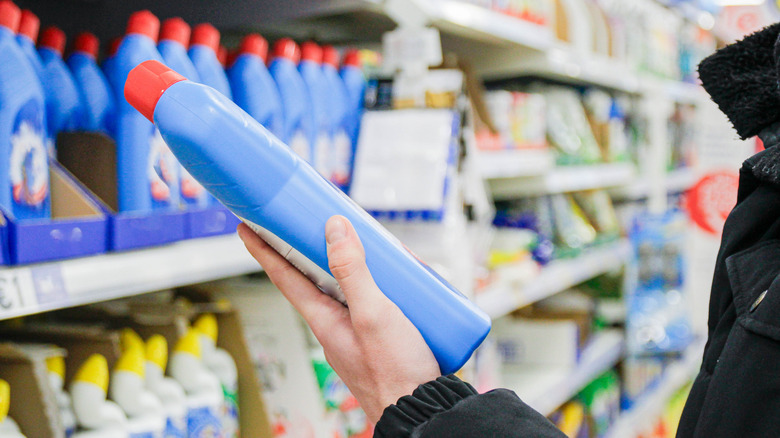 Customer looking at detergent in the store