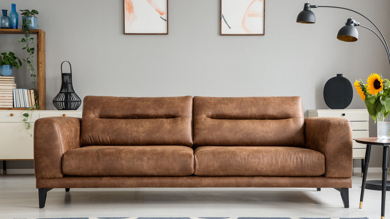 leather brown sofa in stylish room