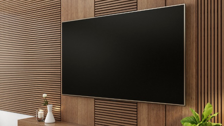 TV on wood paneled wall with horizontal slats