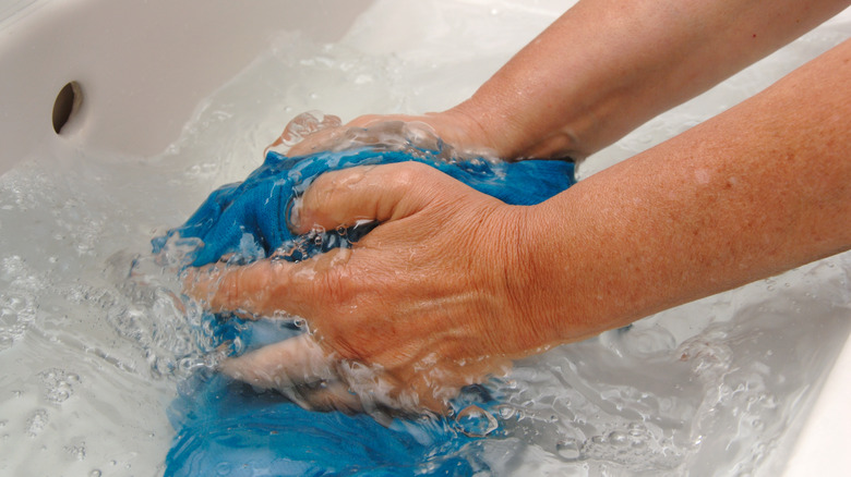 Handwashing clothes in water