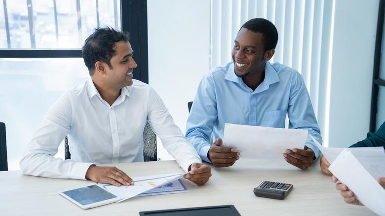 Colleagues working in small office