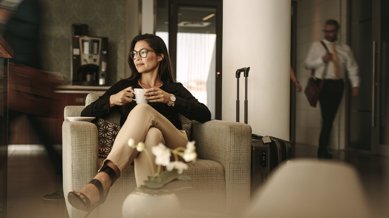 Woman relaxing with coffee while traveling