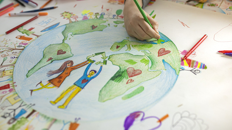 Child drawing picture of Earth